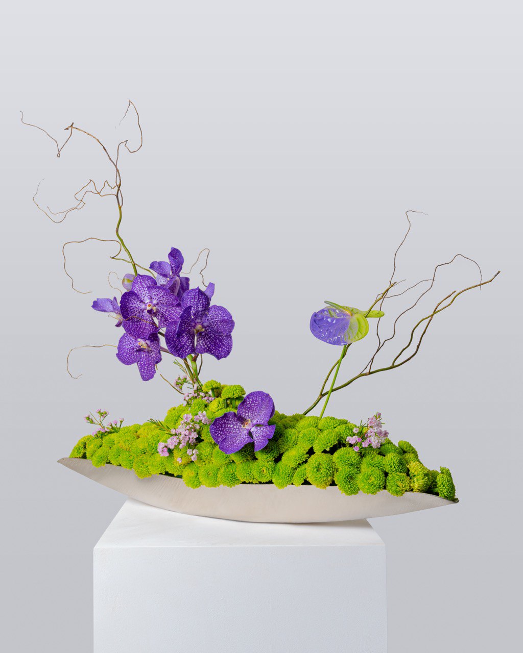 Add sophistication to your table with our custom-designed floral centerpieces, where artistry meets luxury