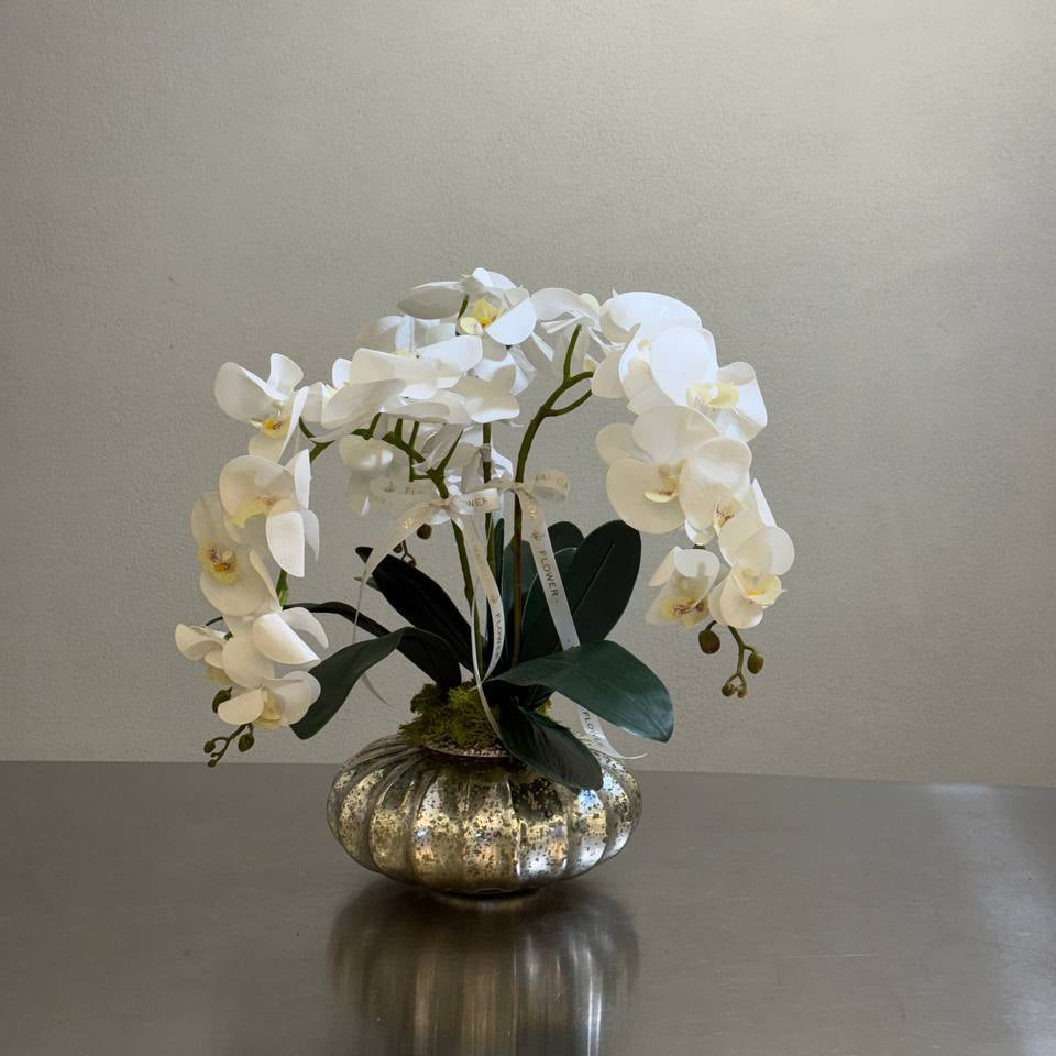 White artificial orchid dome in a round silver glass vase – Vanda Flower Boutique
