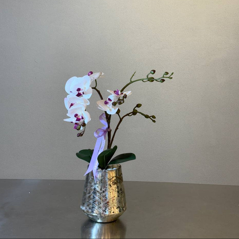 White and fuchsia artificial orchid in a slim patterned silver vase – Vanda Flower Boutique