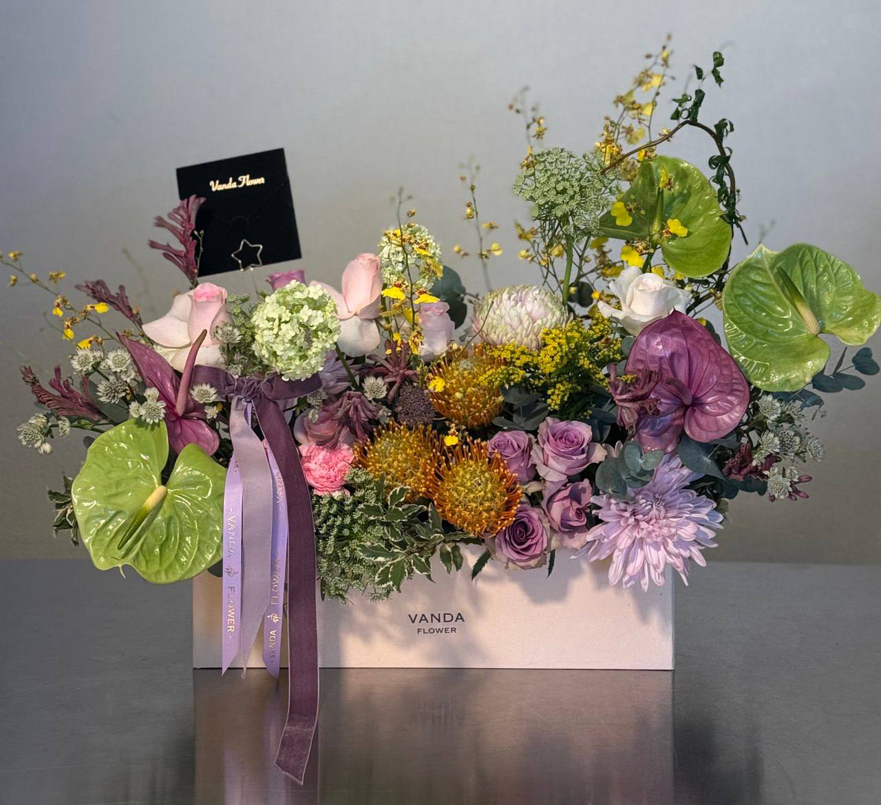 luxury mixed fresh flower arrangement with pastel and vibrant tones in a Vanda Flower box